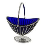 George III silver sugar basket, boat shaped design with openwork sides, swing handle and original bl