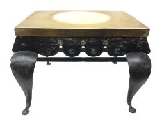 19th century brass and iron footman, the rectangular top with two carry handles above a shaped apron