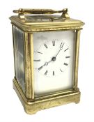 Early 20th century brass five glass carriage clock with button repeater, the brass case engraved wit