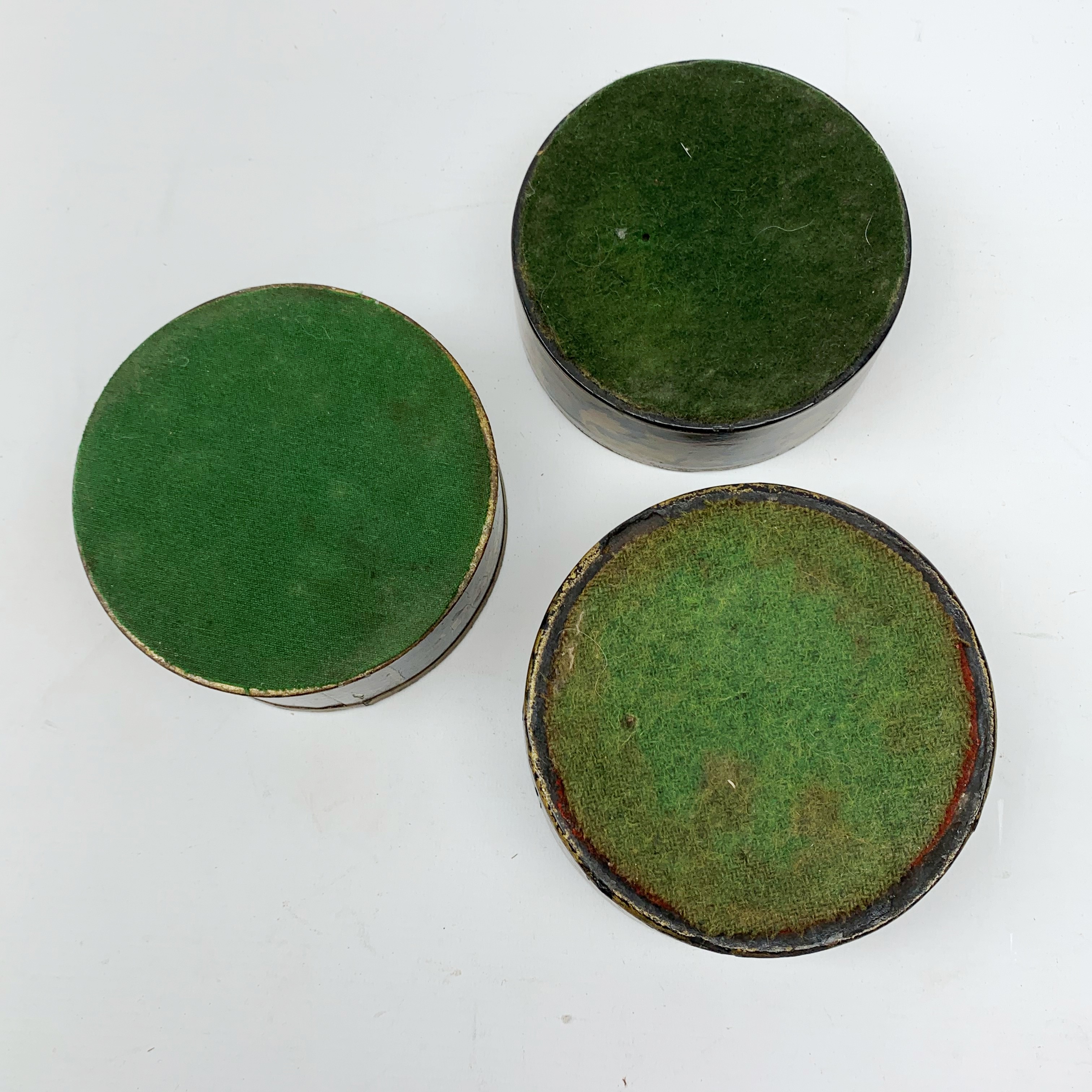 Two Regency black papier-maché wine coasters, together with a toleware example, each with gilt folia - Image 4 of 4