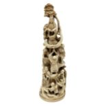 19th century Japanese carved ivory okimono, modelled as a tower of figures, H18cm