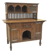Arts and Crafts period oak sideboard, raised triple shaped arch top fitted with cupboard, rectangula