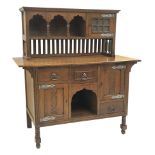 Arts and Crafts period oak sideboard, raised triple shaped arch top fitted with cupboard, rectangula