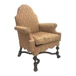 Georgian style walnut framed upholstered armchair, with arched back, outsplayed arms and shaped fri
