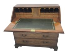 George lll mahogany bureau with crossbanded fall front, the interior with cupboard, drawers and com