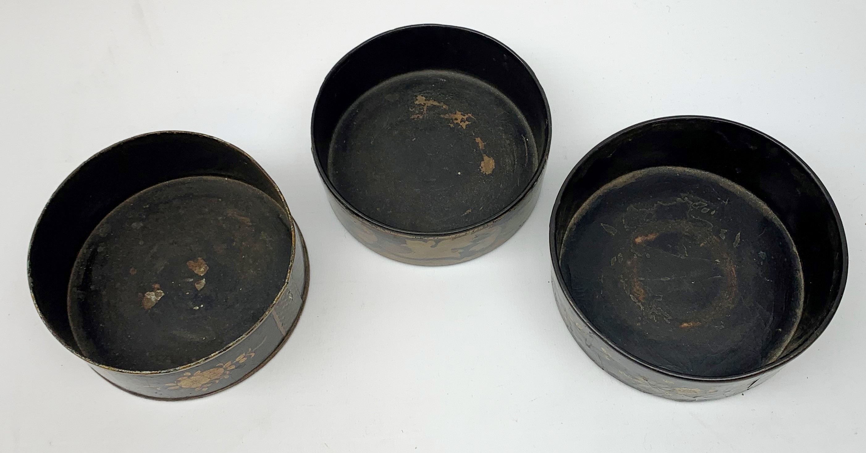 Two Regency black papier-maché wine coasters, together with a toleware example, each with gilt folia - Image 2 of 4