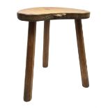 'Mouseman' oak three legged stool with kidney shaped dished seat, by Robert Thompson of Kilburn, 37c