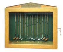 Modern handcrafted miniature set of fourteen 19th century style golf clubs by P.D. Rushworth dated 2