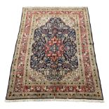 Persian Saroug rug, blue ground with interlacing foliate design, central medallion decorated with st