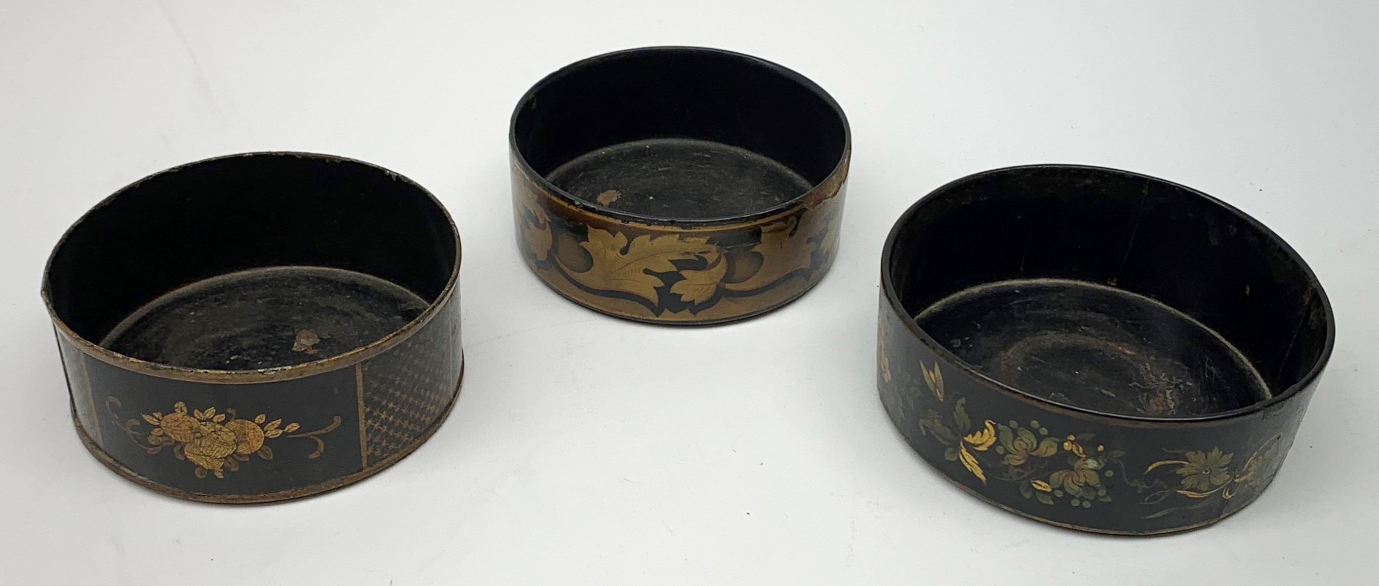 Two Regency black papier-maché wine coasters, together with a toleware example, each with gilt folia - Image 3 of 4