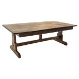 Large oak refectory dining table, rectangular moulded plank top, shaped end supports connected by st