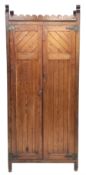 Late Victorian Aesthetic movement pitch pine and oak hall wardrobe, two paneled doors enclosing hook