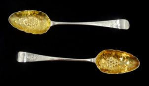 Pair of George III silver berry spoons with later embossed gilded bowls by Peter & Ann Bateman, Lond
