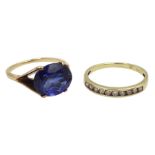 Gold diamond half eternity ring and a gold oval synthetic sapphire ring, both 9ct tested or hallmark