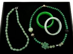 Two jade bangles, jade and cinabar necklace and a celadon jade necklace