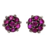 Pair of 9ct white gold ruby and diamond cluster stud earrings, retailed by J W Benson Ltd, London bo