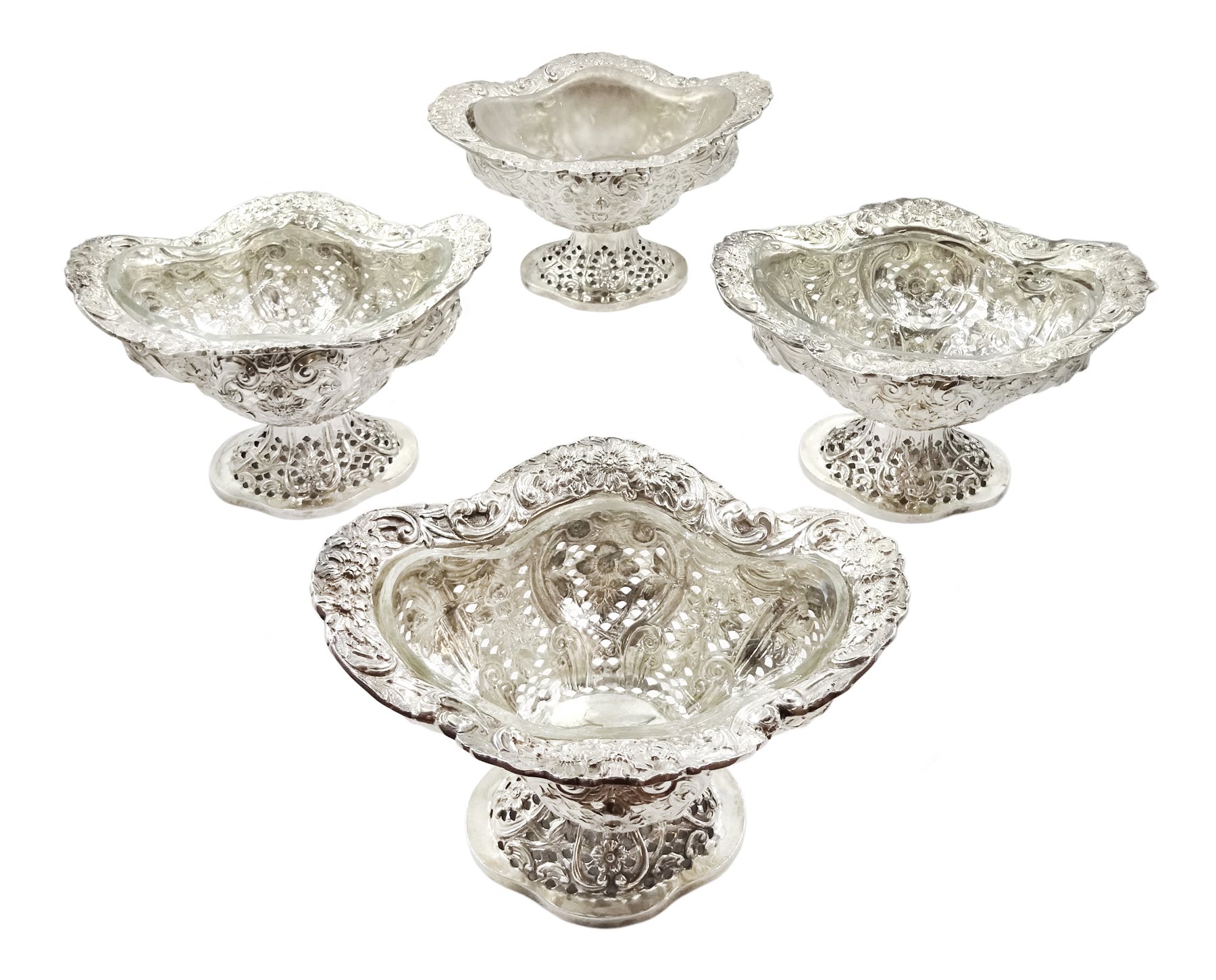 Four Victorian silver pedestal bon bon dishes, embossed foliate and pierced decoration, with glass l - Image 2 of 20