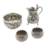 Middle Eastern silver cream jug and sugar bowl, embossed farming decoration, the jug with a cobra ha