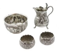 Middle Eastern silver cream jug and sugar bowl, embossed farming decoration, the jug with a cobra ha