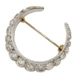 9ct white and yellow gold graduating diamond crescent moon brooch, London 1973, total diamond weight