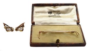 9ct gold riding crop brooch, retailed by Waddinton & Son boxed and a pair of 9ct gold clip on earrin