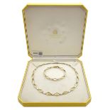 9ct yellow and white gold necklace, stamped 375, retailed by Hugh Rice in original box