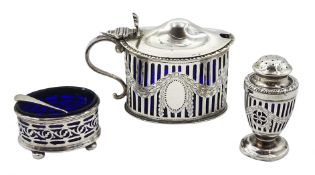 Silver mustard and pepperette by Goldsmiths & Silversmiths Co Ltd, London 1919 and a pierced silver