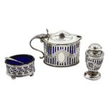 Silver mustard and pepperette by Goldsmiths & Silversmiths Co Ltd, London 1919 and a pierced silver