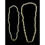 Two single strand cultured pearl necklaces, both with 9ct gold clasps,stamped or hallmarked