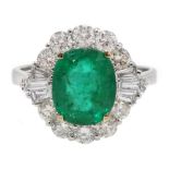 18ct white gold oval emerald, round and baguette cut diamond ring, stamped 750, emerald approx 1.90