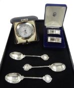 Silver mounted quartz alarm clock by Carr's of Sheffield Ltd, 2000 cased, two silver napkin rings bo