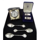 Silver mounted quartz alarm clock by Carr's of Sheffield Ltd, 2000 cased, two silver napkin rings bo