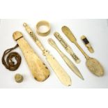 A selection of bone, to include shoe horn, spoon, napkin ring, thimble, etc. (8).