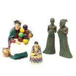 A Royal Doulton figurine, The Old Balloon Seller HN1315, together with a small figure of a seated bu