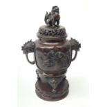 A 20th century Japanese bronze tripod censer, pierced cover with Dog of Fo Finial, the body cast in