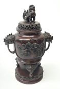 A 20th century Japanese bronze tripod censer, pierced cover with Dog of Fo Finial, the body cast in