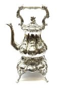 A Victorian style silver plated teapot on stand, each with foliate decoration throughout, overall H4