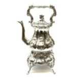 A Victorian style silver plated teapot on stand, each with foliate decoration throughout, overall H4
