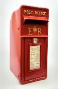 A large reproduction red painted cast metal post box, H59.5cm.