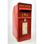 A large reproduction red painted cast metal post box, H59.5cm.