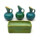 Three Linthorpe pottery jugs, two with turquoise ground, the other with merging turquoise and green,