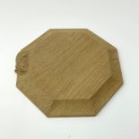 'Mouseman' small octagonal oak stand/chopping board by Robert Thompson of Kilburn, carved mouse sign
