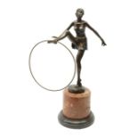 An Art Deco style bronze after D Alonzo, modelled as a female hoop dancer, with impressed mark and f