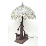 Large Tiffany style lamp, the bronze finish base modelled as a lady walking two Labradors with leade