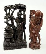 Chinese carved hardwood and silver wire inlaid group depicting two female figures beneath a blossomi