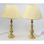 A pair of large gilt effect table lamps with knopped stems, with cream pleated shades, overall H84cm