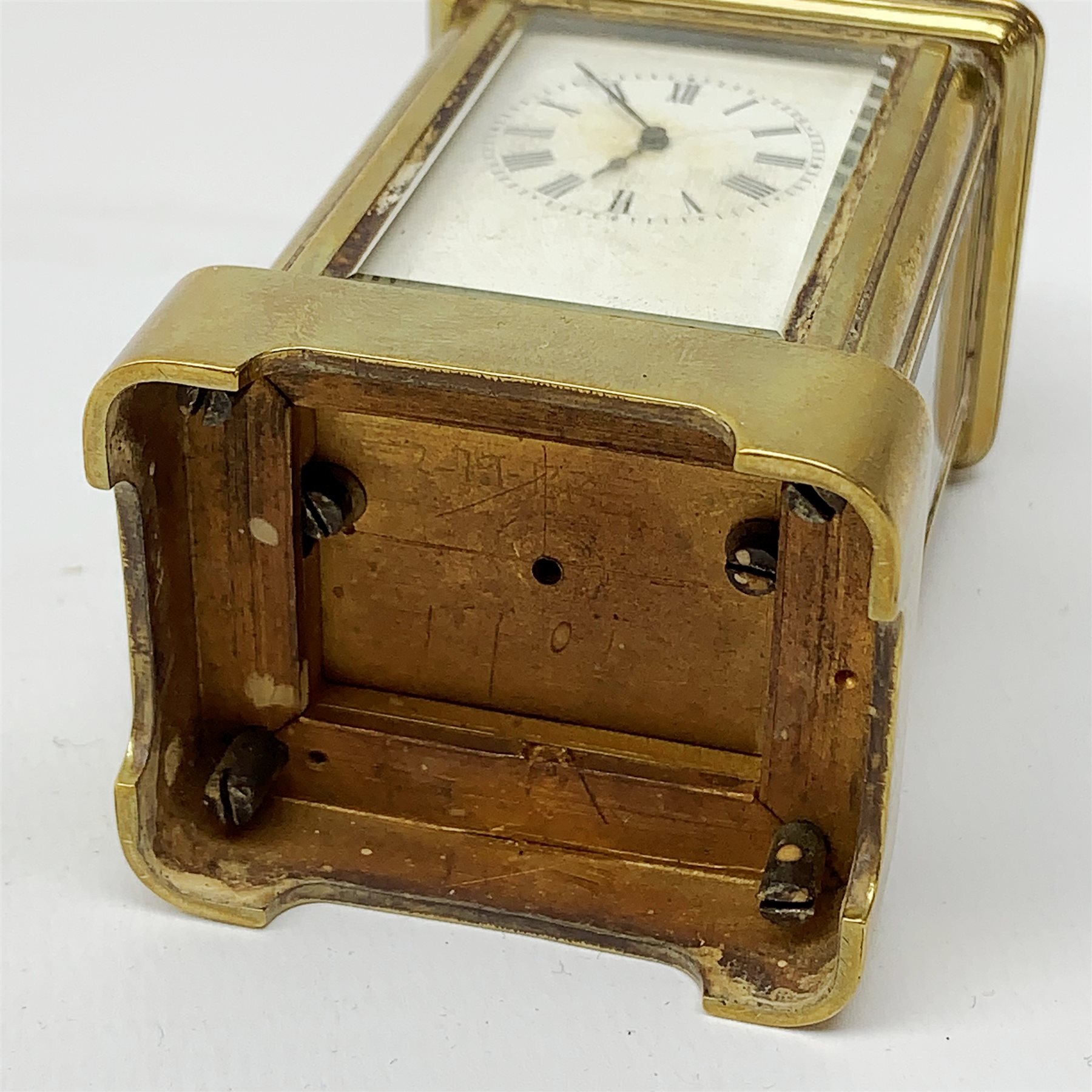 A brass cased miniature carriage clock, the white enamel dial with black Roman numerals, H7cm. - Image 7 of 7