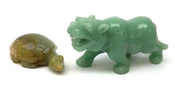 Two carved jade figures, the first modelled as a tiger, L10.5cm, the second as a turtle, L6.5cm.