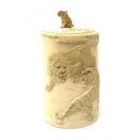 Indian ivory tusk box, second quarter of 20th century, of tapering form carved in relief with lions