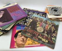 A selection of assorted vinyl records and singles, to include The Beatles Sgt Peppers Lonely Hearts
